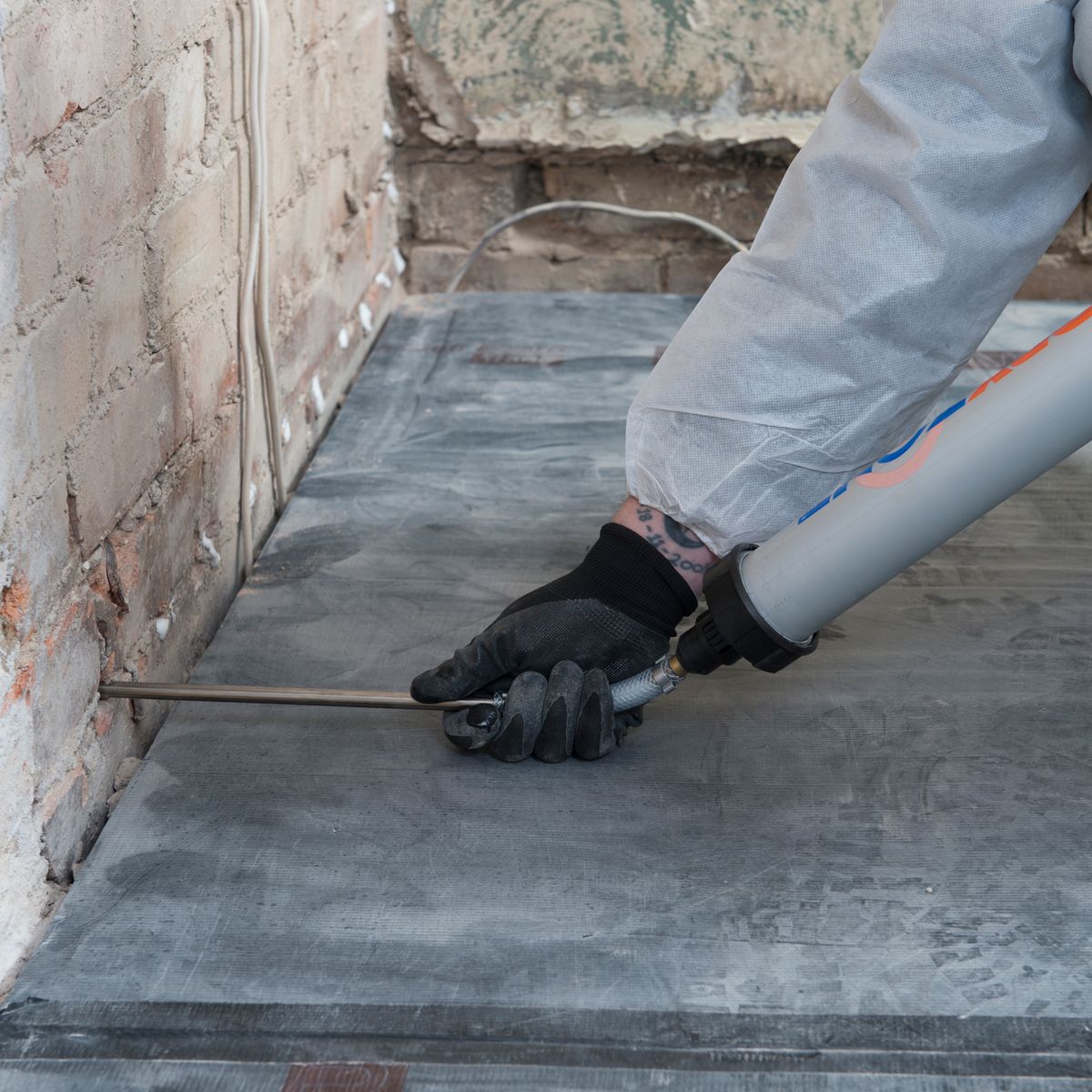Damp proofing treatment applied to wall